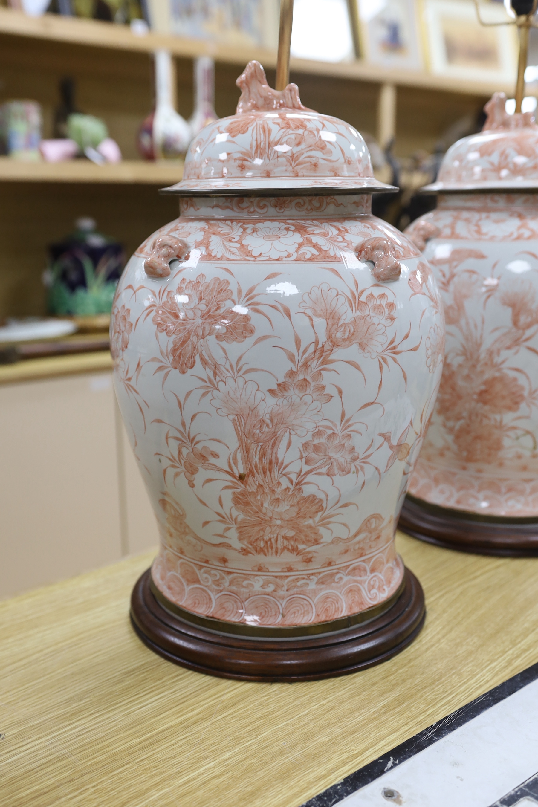 A pair of Chinese style iron red porcelain table lamps